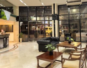 Main hotel lobby and reception area with elegant marble flooring, comfortable seating, and a welcoming atmosphere for arriving guests at HR Plaza Luxor.