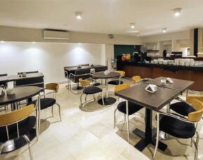 Breakfast buffet area displaying fresh pastries, beverages, and a selection of morning dining options for guests at HR Plaza Luxor.