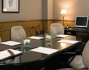 Private boardroom featuring executive seating, presentation facilities, and a professional setting for meetings and business discussions at Hotel Lafayette.