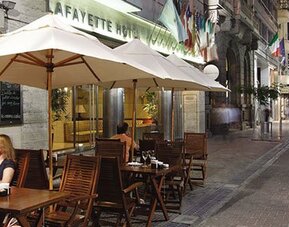 Outdoor café terrace at Hotel Lafayette overlooking a lively pedestrian street, offering al fresco dining in the heart of the city at Hotel Lafayette.