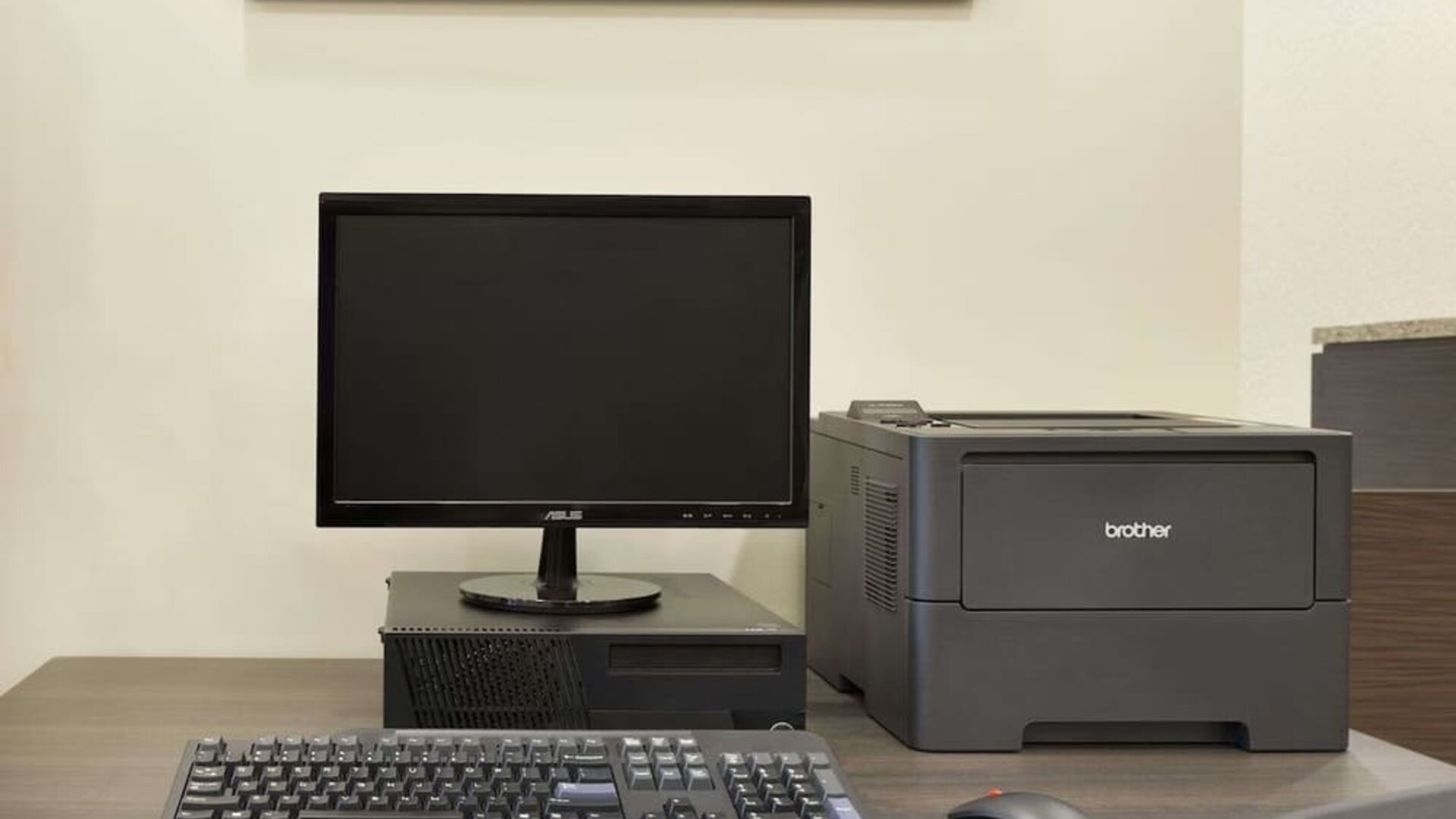 Business center with desktop computer, printer and workstation for guest use at Days Inn & Suites By Wyndham Lindsay.