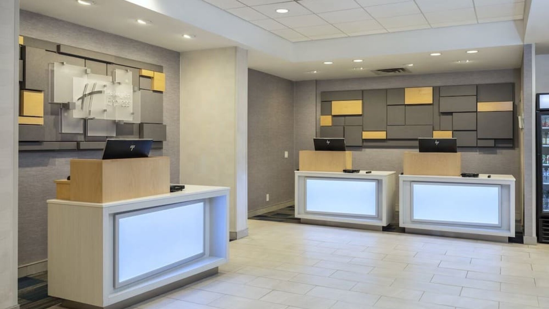 Modern reception area with front desk and welcoming check-in space at Holiday Inn Express Toronto Downtown.