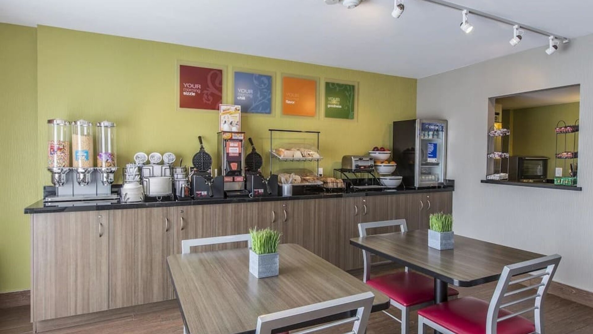 Complimentary breakfast area offering fresh coffee, cereals, pastries, and hot breakfast selections at Comfort Inn Sydney.