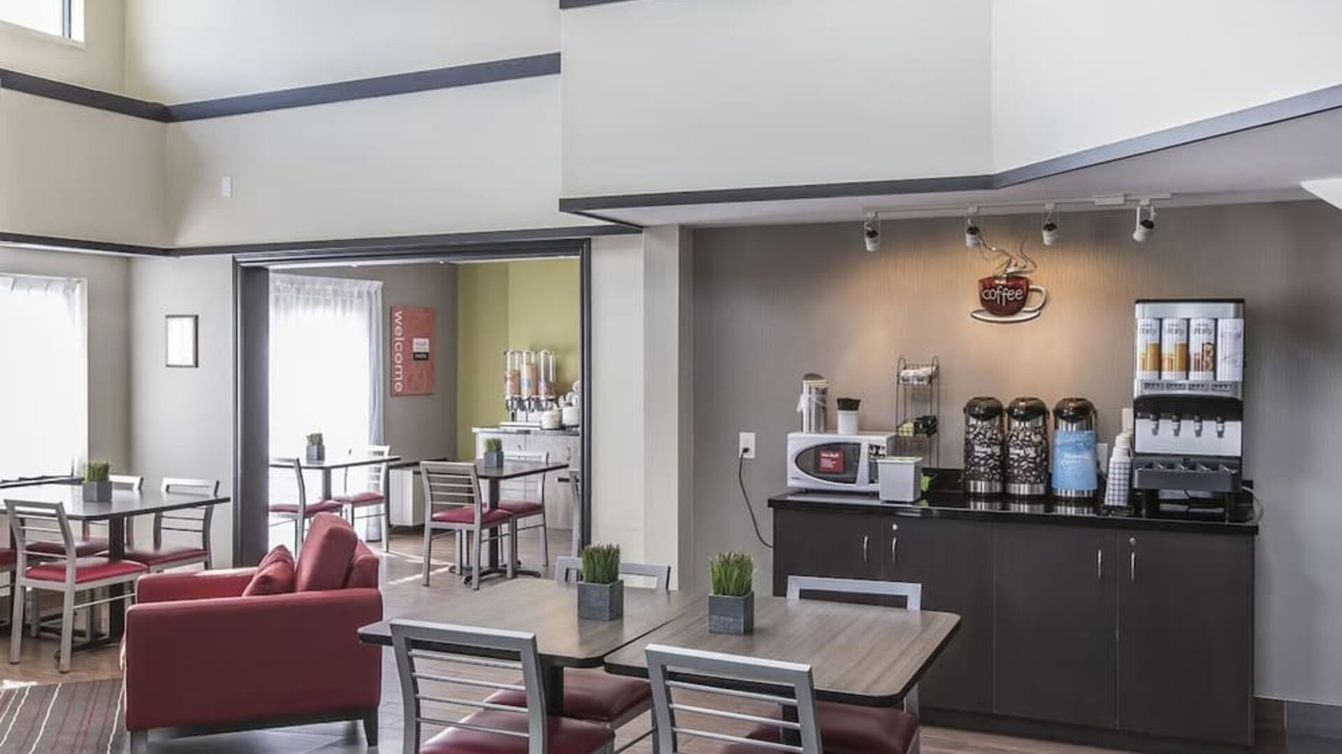 Welcoming breakfast lounge with complimentary coffee and relaxed seating at Comfort Inn Sydney.