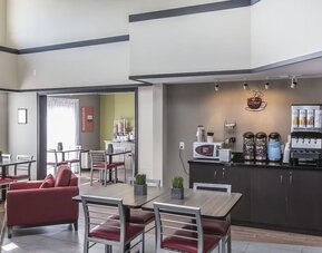 Welcoming breakfast lounge with complimentary coffee and relaxed seating at Comfort Inn Sydney.