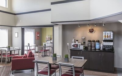 Welcoming breakfast lounge with complimentary coffee and relaxed seating at Comfort Inn Sydney.