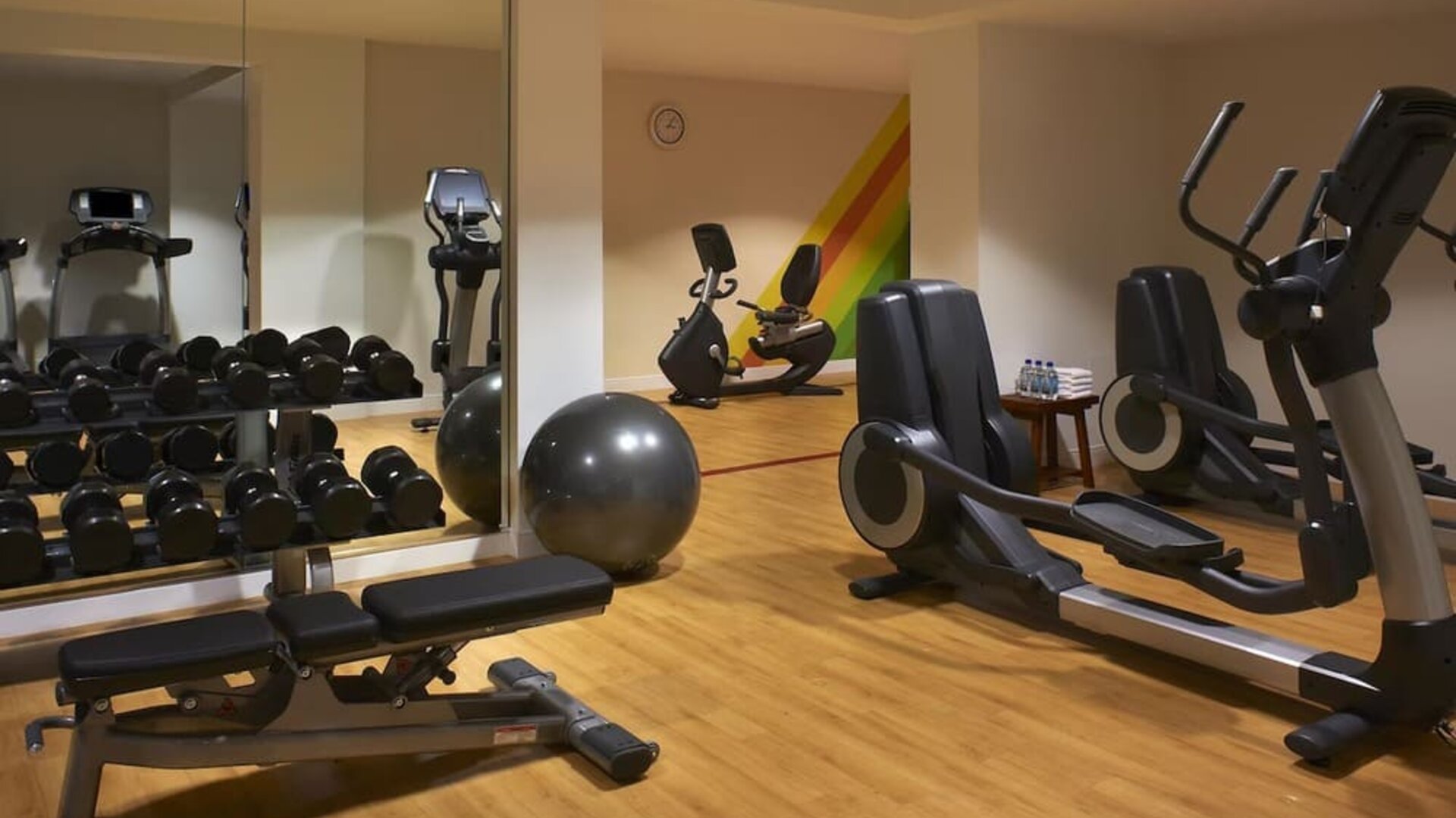Fully equipped fitness center featuring cardio machines, free weights, strength-training equipment, and exercise space at Hyatt Centric Delfina Santa Monica.