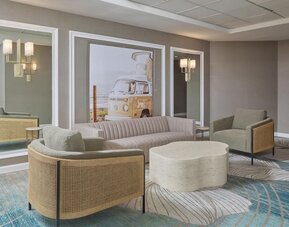Stylish lobby seating area featuring modern furnishings, designer décor, and inviting spaces for guests to unwind at Hyatt Centric Delfina Santa Monica.