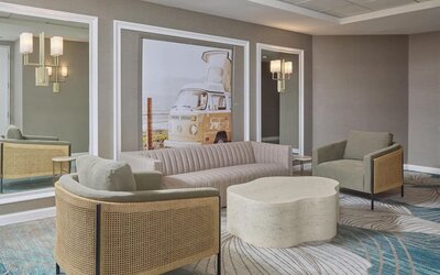 Stylish lobby seating area featuring modern furnishings, designer décor, and inviting spaces for guests to unwind at Hyatt Centric Delfina Santa Monica.