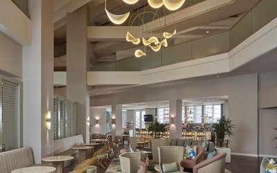 Contemporary hotel lobby featuring stylish lounge seating, modern lighting, and an inviting social atmosphere at Hyatt Centric Delfina Santa Monica.