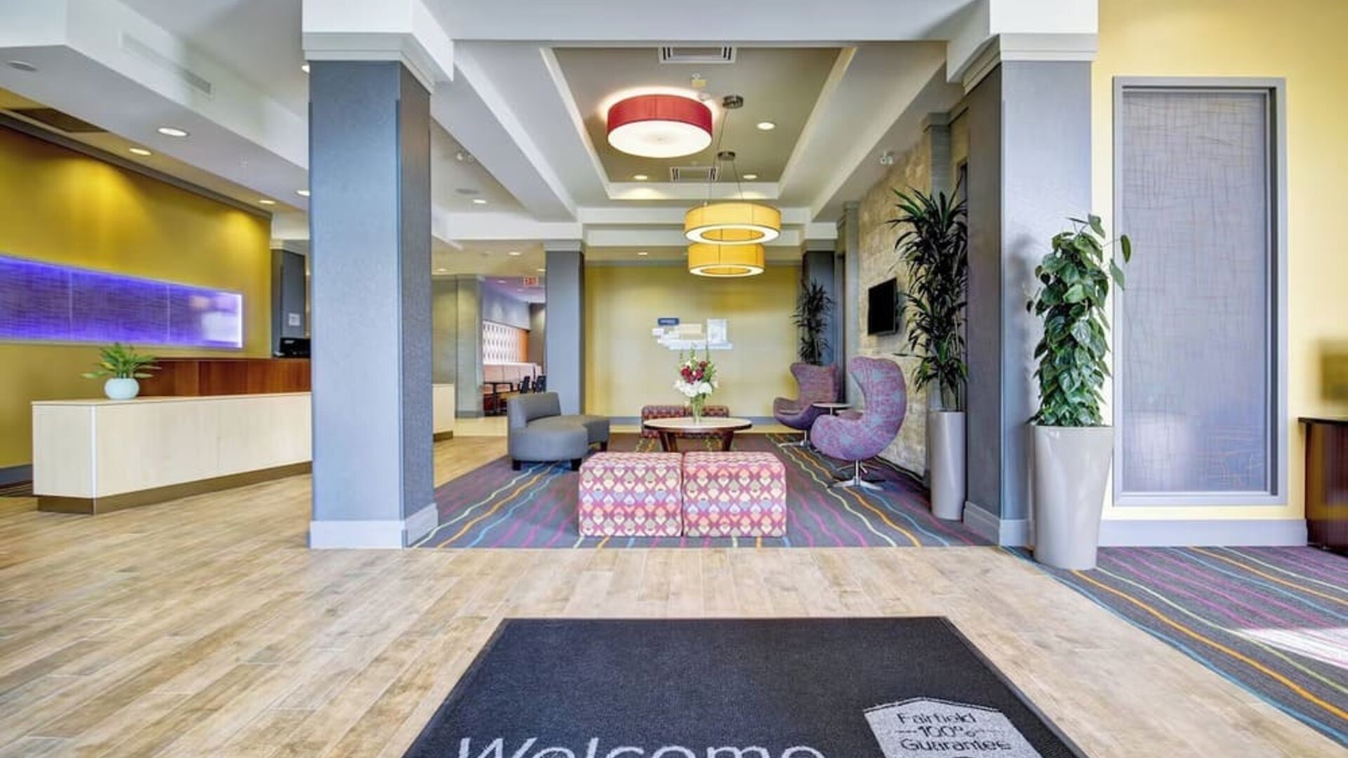 Modern hotel lobby featuring stylish seating, contemporary décor, and a welcoming reception area at Fairfield Inn & Suites Guelph.
