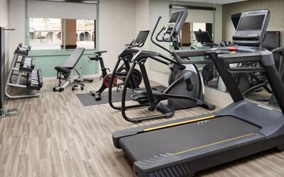 Modern fitness center equipped with cardio machines, free weights, and strength-training equipment at Hyatt Place Scottsdale/Old Town.