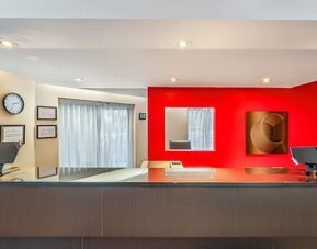 Front desk reception area providing friendly service and convenient guest check-in at Comfort Inn Sherbrooke.