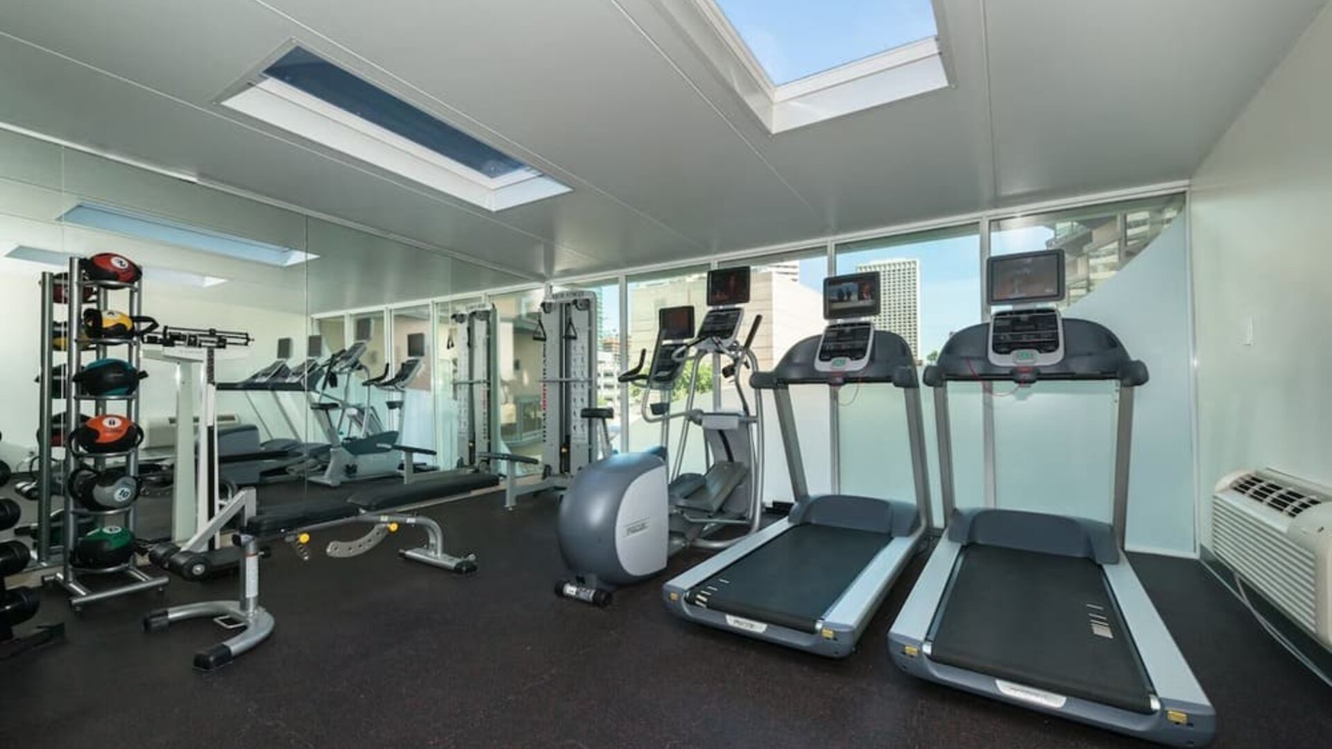 Fitness center featuring treadmills, strength equipment, and free weights at Holiday Inn Express Edmonton Downtown, an IHG Hotel.