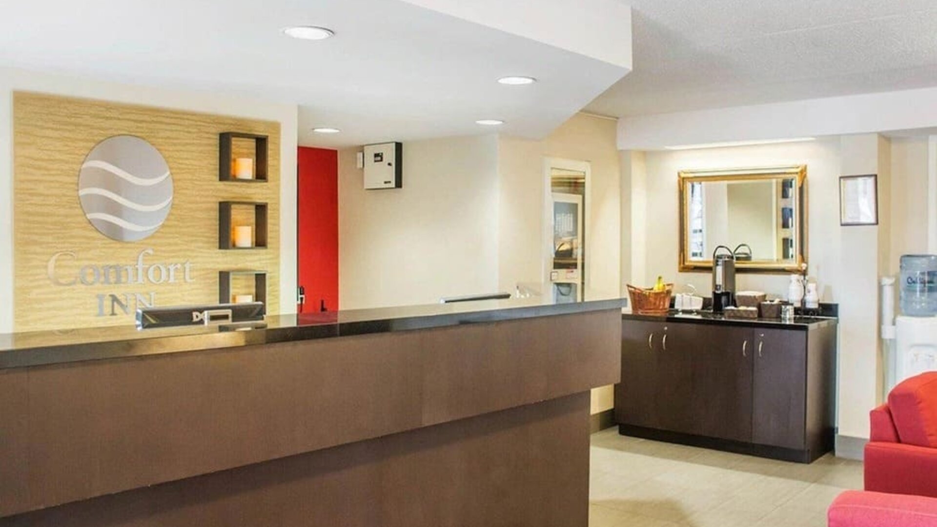 Welcoming reception desk with seating at Comfort Inn Brantford.