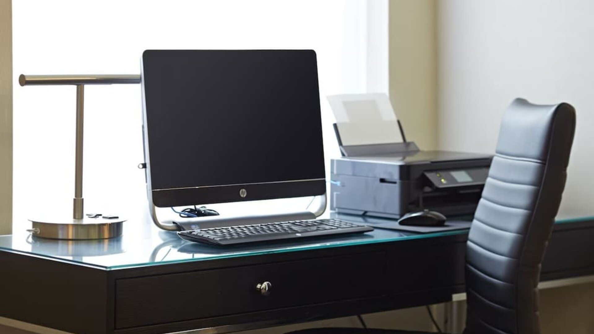 Business center with a desktop computer and printer at Comfort Inn Sault Ste. Marie.