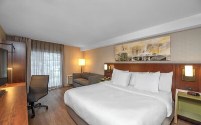 King guest room with a work desk at Comfort Inn Sault Ste. Marie.