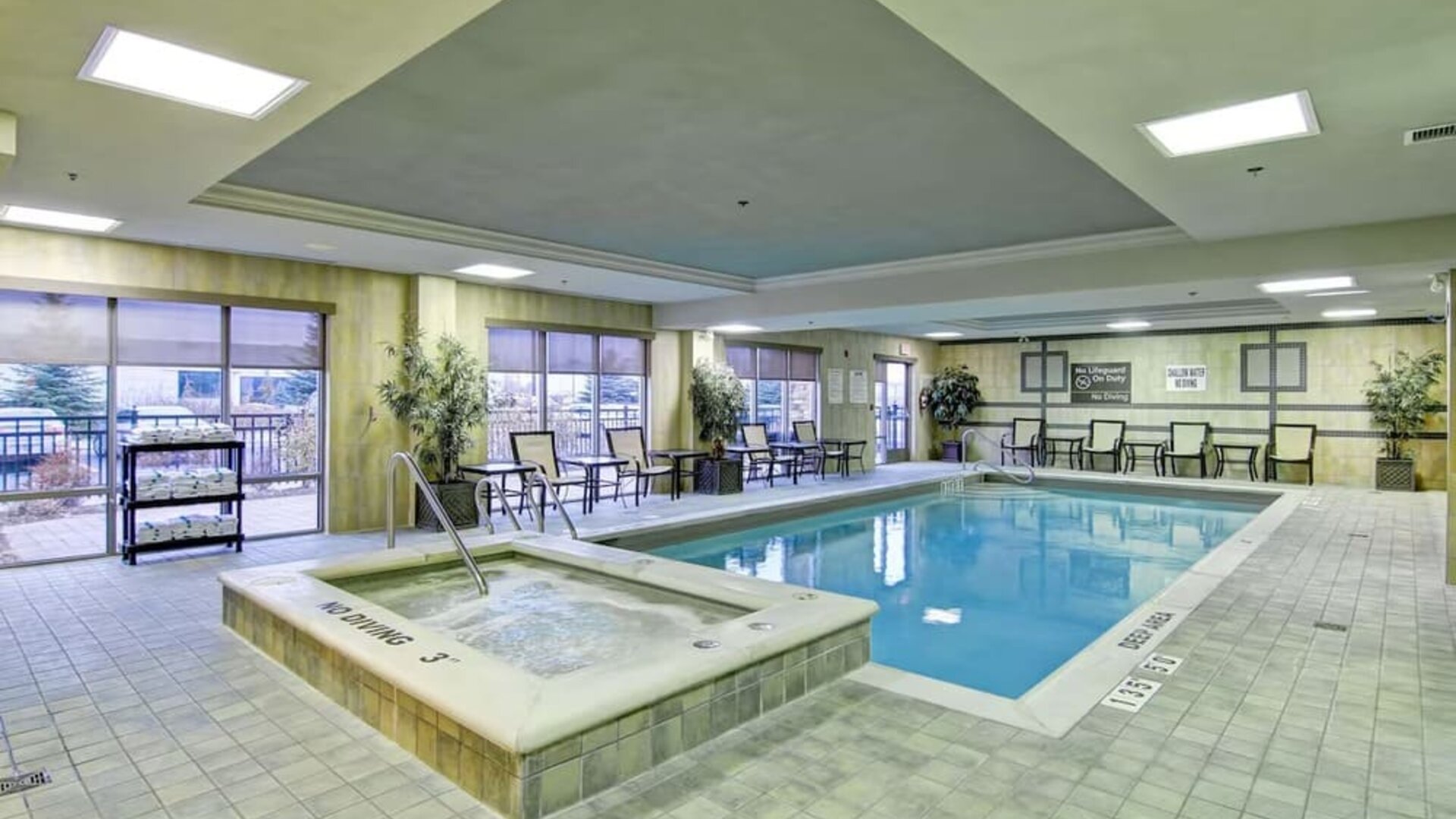Indoor swimming pool and hot tub at Hampton Inn & Suites By Hilton Guelph.