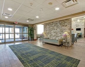 Hotel lobby entrance with seating area at Hampton Inn & Suites By Hilton Guelph.