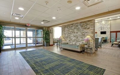 Hotel lobby entrance with seating area at Hampton Inn & Suites By Hilton Guelph.