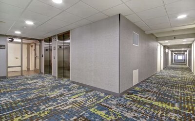 Hotel hallway with elevator access at Hampton Inn & Suites By Hilton Guelph.