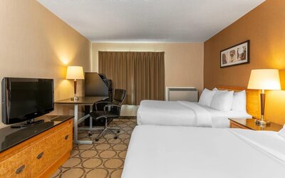Guest room with two queen beds and a work desk at Comfort Inn Brandon.