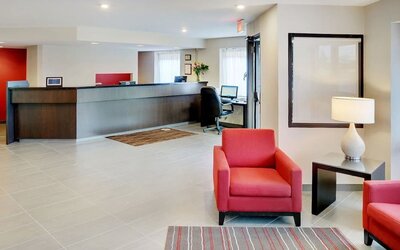 Hotel lobby with reception desk and seating area at Comfort Inn Brandon.