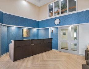 Hotel reception area with modern lobby design at Comfort Inn Belleville.