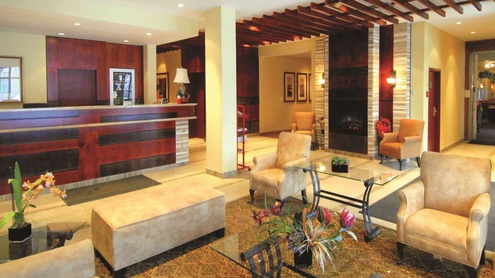 Hotel lobby with seating area and reception desk at Days Inn Edmonton Downtown.