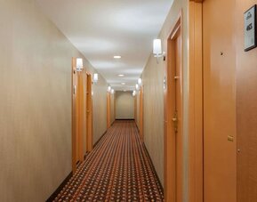 Guest hallway with room entrances at Days Inn Edmonton Downtown.