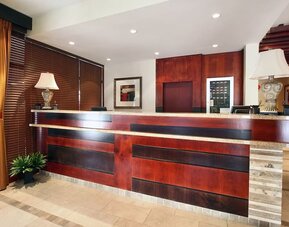 Hotel reception desk at Days Inn Edmonton Downtown.