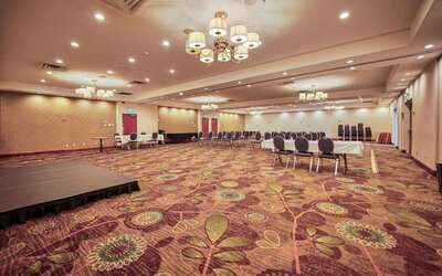 Meeting room with classroom-style seating at Amenida Residences.