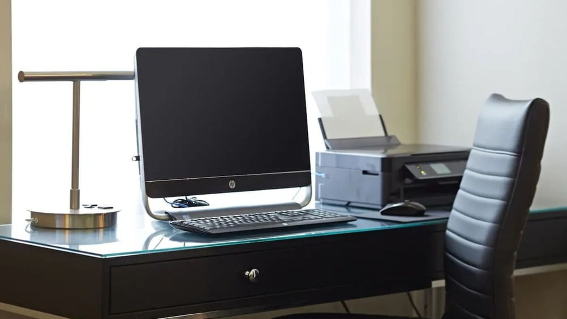 Business center with a computer and printer at Comfort Inn Winnipeg Airport.