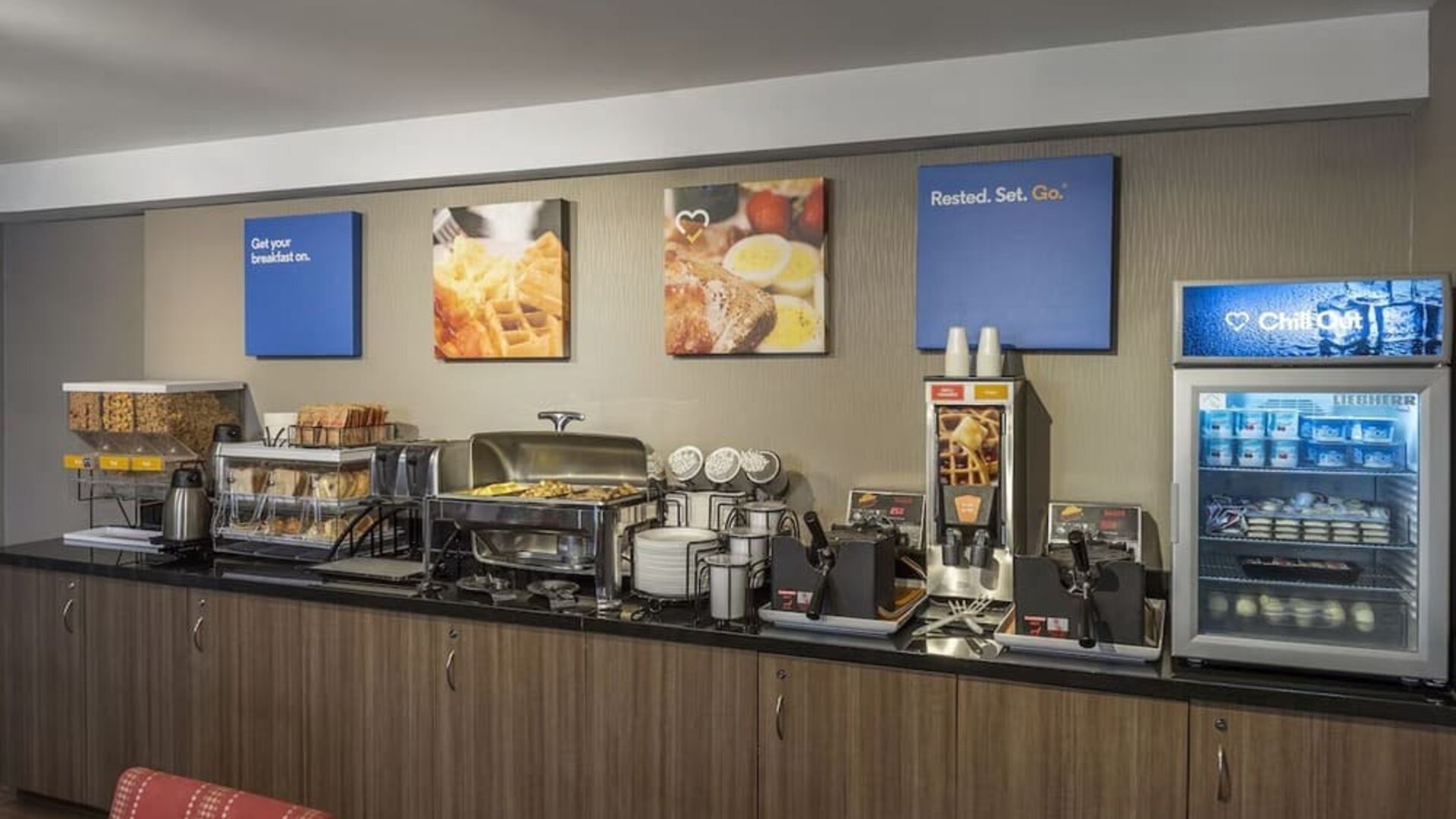 Complimentary breakfast station with hot and cold selections at Comfort Inn Winnipeg Airport.