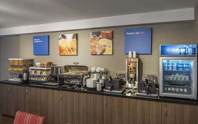 Complimentary breakfast station with hot and cold selections at Comfort Inn Winnipeg Airport.