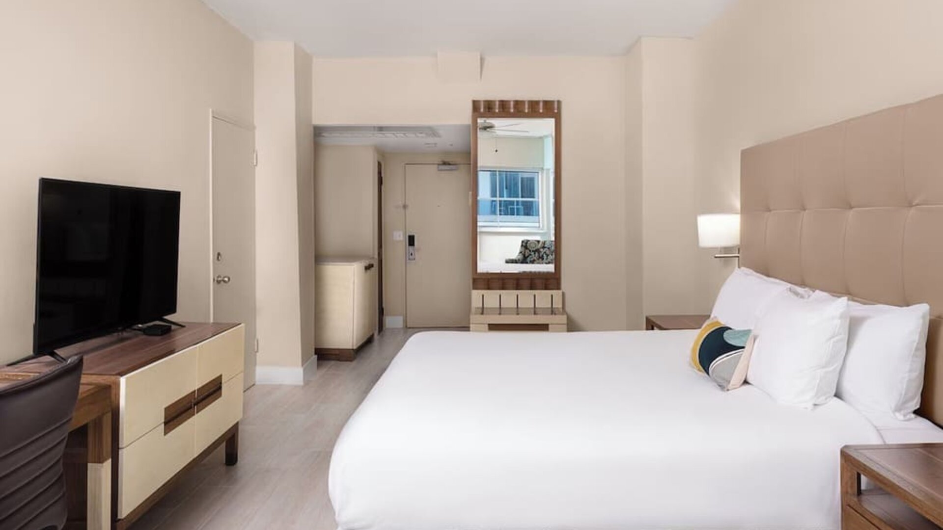Guest room with a king bed and panoramic ocean view at Sherry Frontenac Oceanfront Hotel.