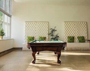Hotel game room with a billiards table at Sherry Frontenac Oceanfront Hotel.
