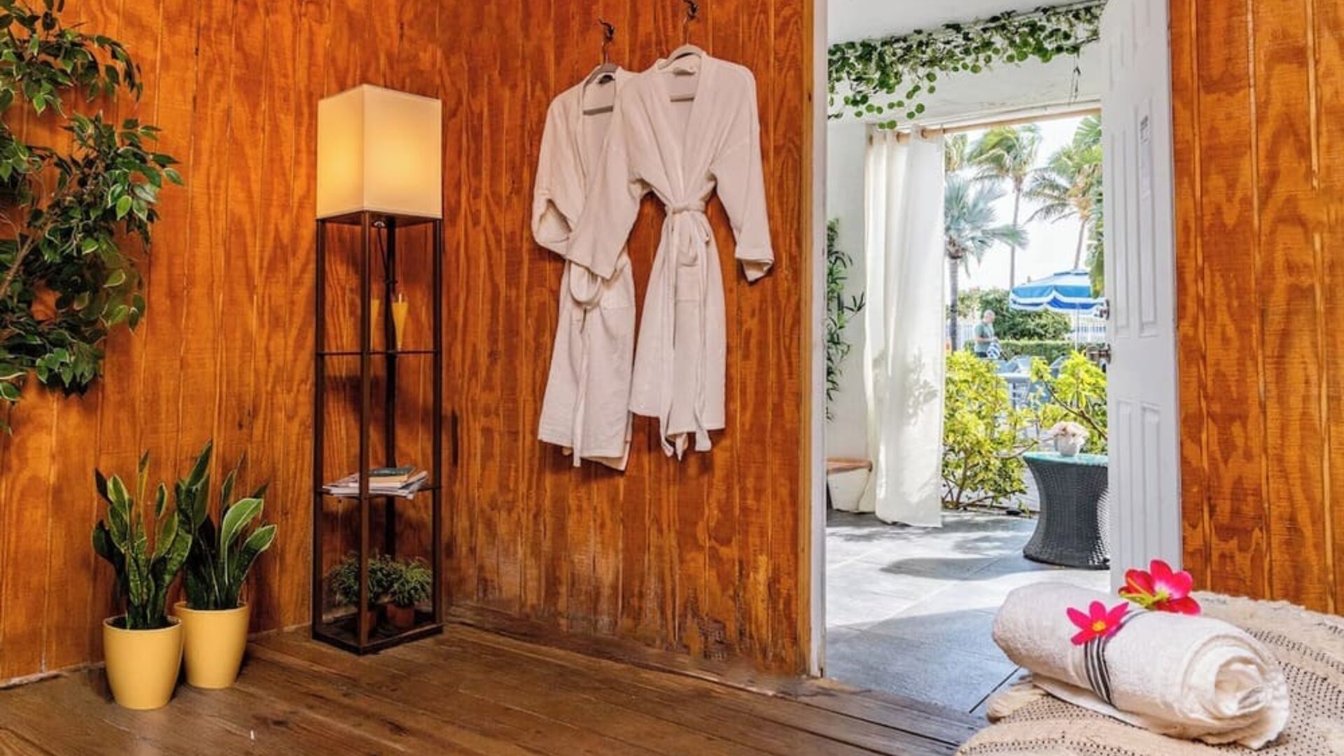 Spa relaxation area with robes and seating at Sherry Frontenac Oceanfront Hotel.
