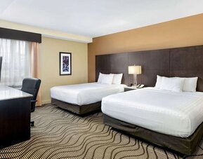 Guest room with two queen beds at La Quinta Inn & Suites By Wyndham Oshawa.
