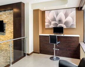 Business center with computer workstation at La Quinta Inn & Suites By Wyndham Oshawa.