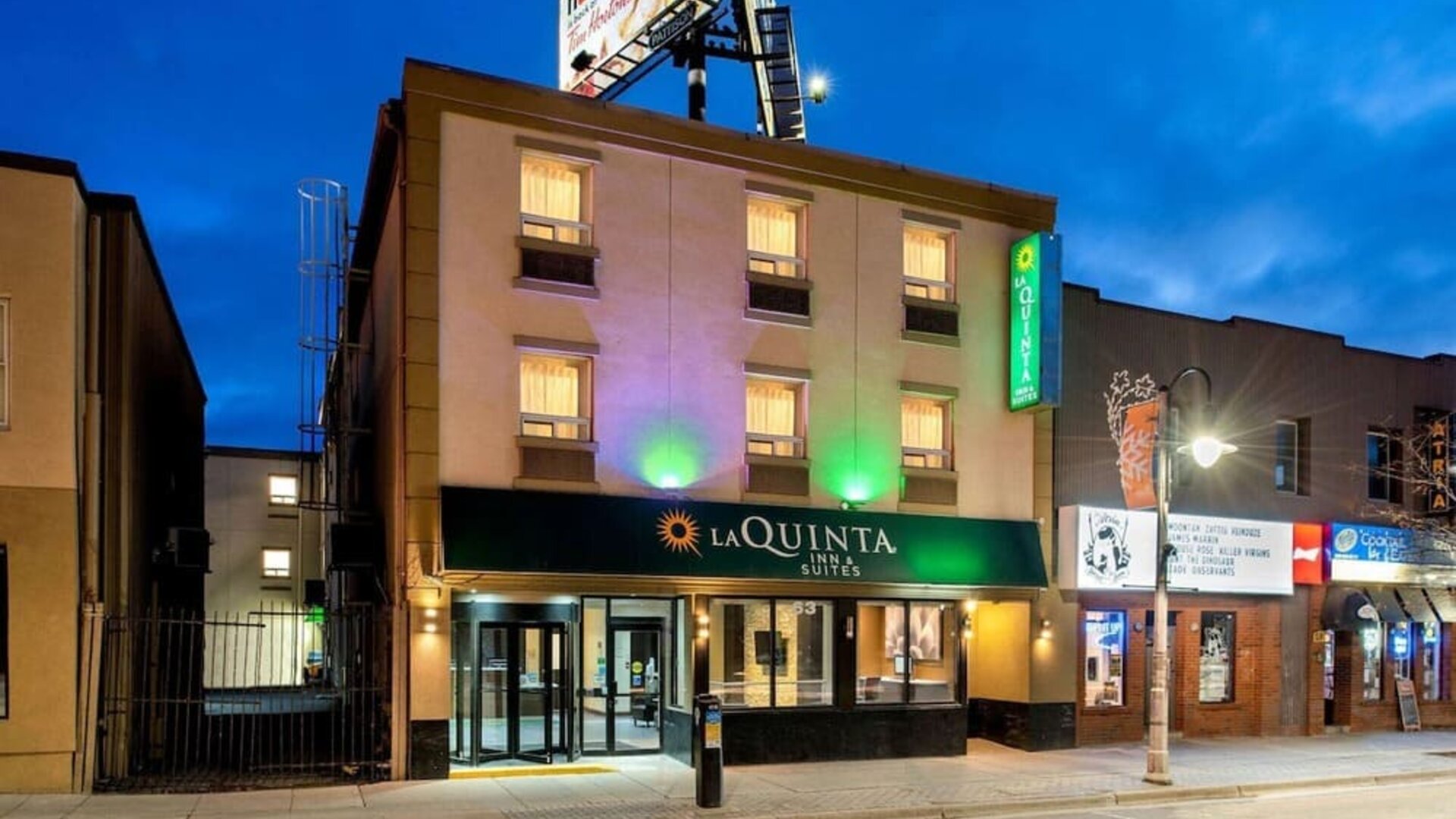 Exterior view of La Quinta Inn & Suites By Wyndham Oshawa at dusk.