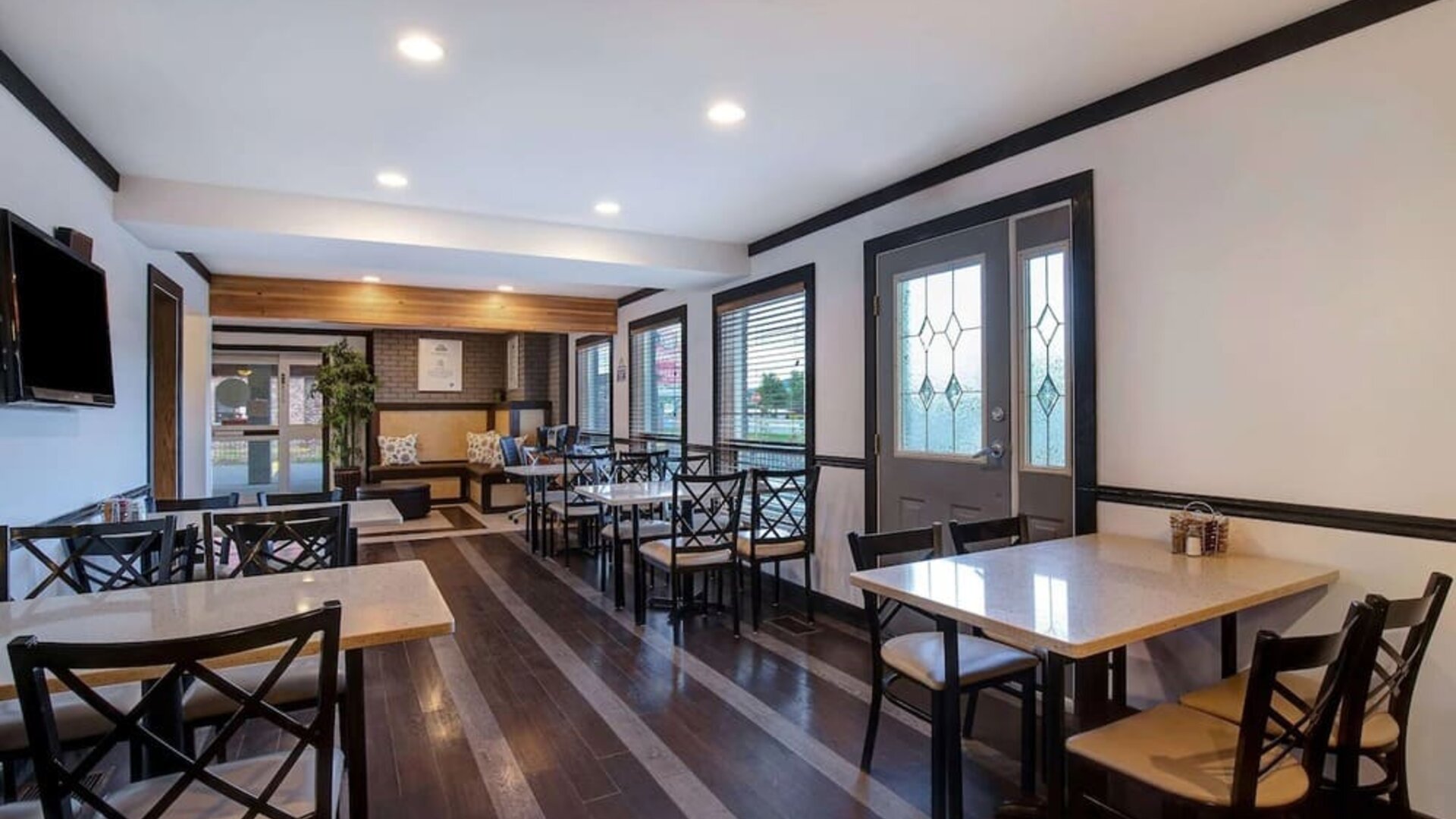 Breakfast dining area with tables and seating at Days Inn Vernon.