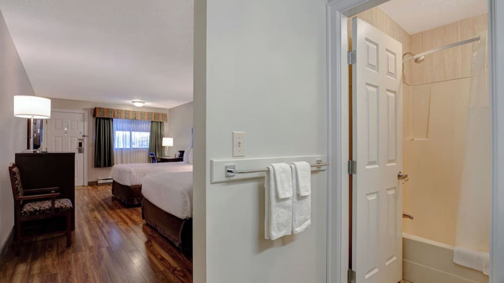 Guest room ensuite with bathroom entrance at Days Inn Vernon.