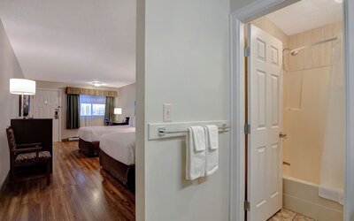 Guest room ensuite with bathroom entrance at Days Inn Vernon.