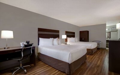 Guest room with two queen beds and work desk at Days Inn Vernon.