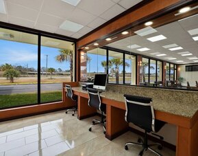 Business center with computer workstations, large windows and roadside views at Quality Inn Yemassee - Point South I-95.