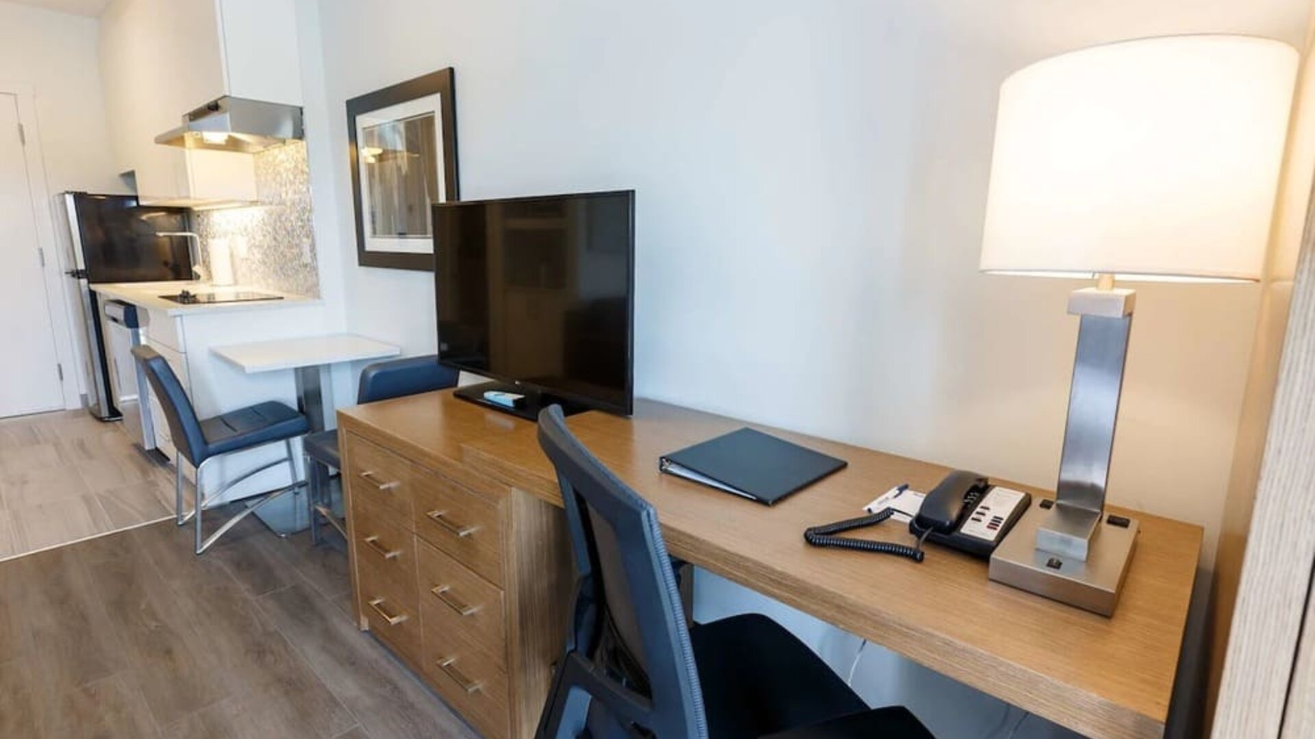 Day use guest room with work desk and in-door kitchen at Executive Residency By Best Western.