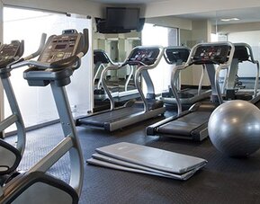 Fully equipped fitness center with cardio machines, free weights and exercise equipment at NH Buenos Aires 9 De Julio.