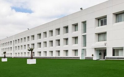 Exterior view of NH Collection Mexico City Airport T2 featuring contemporary architecture, landscaped grounds and convenient airport location.