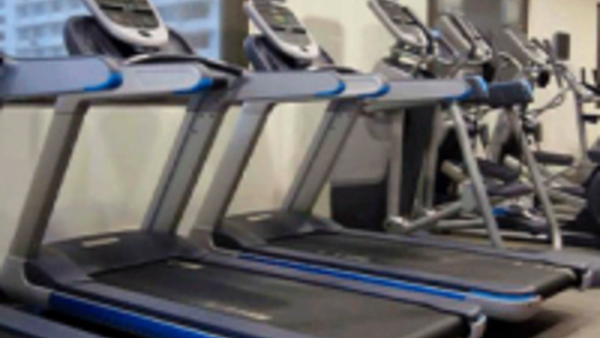 Fully equipped fitness center with treadmills and modern cardio equipment at Crowne Plaza Panama.